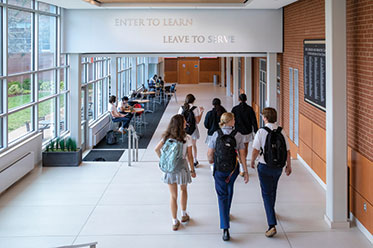 Students walking down a hallway. Links to Gifts of Life Insurance Students walking down a hallway. Links to Gifts of Life Insurance