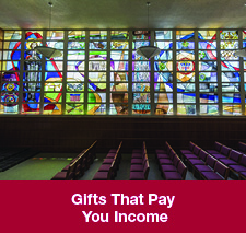 Stained glass in a chapel. Gifts That Pay You Income Rollover